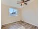 Simple bedroom with ceiling fan and window at 3338 S Canosa Ct, Englewood, CO 80110