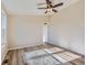 Simple bedroom with ceiling fan and large window at 3338 S Canosa Ct, Englewood, CO 80110