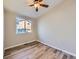 Well-lit bedroom with ceiling fan and wood-look floors at 3338 S Canosa Ct, Englewood, CO 80110