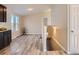 Light and bright dining area with wood-look floors and access to kitchen at 3338 S Canosa Ct, Englewood, CO 80110