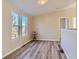 Bright dining area with wood-look floors and large windows offering natural light at 3338 S Canosa Ct, Englewood, CO 80110