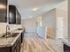 Kitchen with dark cabinets, granite counters, and stainless steel sink at 3338 S Canosa Ct, Englewood, CO 80110