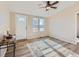 Spacious living room with light walls and wood-look floors at 3338 S Canosa Ct, Englewood, CO 80110