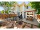 Outdoor patio area with wicker chairs and a picnic table perfect for entertaining at 1265 S Sherman St, Denver, CO 80210