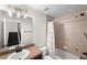 Bathroom featuring a mirror, vanity, shower and tub at 1265 S Sherman St, Denver, CO 80210