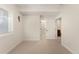 Bedroom featuring a window, walk-in closet, and neutral carpeting at 1265 S Sherman St, Denver, CO 80210