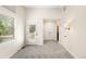 Clean bedroom with neutral walls and carpet, shuttered windows, and access to a private balcony at 1265 S Sherman St, Denver, CO 80210