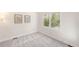 Neutral bedroom featuring plush carpet, and shuttered windows offering natural light and a comfortable space at 1265 S Sherman St, Denver, CO 80210