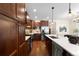 Spacious kitchen featuring wood cabinets, quartz countertops, and stainless steel appliances at 1265 S Sherman St, Denver, CO 80210