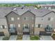 Aerial view of modern townhomes, highlighting the community layout and architectural details at 5387 Pierson Ct, Wheat Ridge, CO 80033