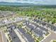 A neighborhood of townhouses features mountain views, modern architecture, sidewalks, and landscaping at 5387 Pierson Ct, Wheat Ridge, CO 80033