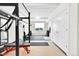 A basement featuring gym equipment, rubber flooring, and ample natural light at 5387 Pierson Ct, Wheat Ridge, CO 80033