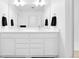 Bathroom with double sink vanity, modern fixtures, and a large mirror at 5387 Pierson Ct, Wheat Ridge, CO 80033