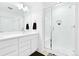 Bathroom featuring a glass-enclosed shower and modern vanity with ample storage at 5387 Pierson Ct, Wheat Ridge, CO 80033