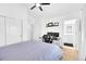 Bedroom with fan, desk, and access to bathroom and walk-in closet at 5387 Pierson Ct, Wheat Ridge, CO 80033