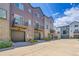 Modern townhome exteriors boast private balconies, attached garages, and contemporary design at 5387 Pierson Ct, Wheat Ridge, CO 80033