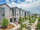Well-maintained townhome community with mature landscaping and walkways at 5387 Pierson Ct, Wheat Ridge, CO 80033