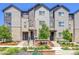 Attractive townhome exterior with landscaping, hardiplank, and stone detailing at 5387 Pierson Ct, Wheat Ridge, CO 80033