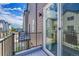 Townhome view from the balcony, showcasing the deck with a sliding glass door at 5387 Pierson Ct, Wheat Ridge, CO 80033