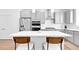 Stylish kitchen features stainless steel appliances and sleek countertops at 5387 Pierson Ct, Wheat Ridge, CO 80033