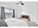 Spacious main bedroom with a vaulted ceiling, dresser, mirror and neutral color palette at 5387 Pierson Ct, Wheat Ridge, CO 80033