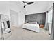 Main bedroom featuring a comfortable bed, mirror, and contemporary decor at 5387 Pierson Ct, Wheat Ridge, CO 80033