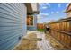 Backyard area featuring pavers, a small patch of green space, and a grill for outdoor cooking at 10360 E 57Th Pl, Denver, CO 80238