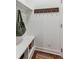 Mud room with bench, coat hooks and stylish rug at 10360 E 57Th Pl, Denver, CO 80238
