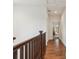 Hallway with wood floors and views to other rooms at 10360 E 57Th Pl, Denver, CO 80238