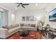Bright living room with ceiling fan, comfortable seating and a stylish rug at 10360 E 57Th Pl, Denver, CO 80238