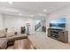 Relaxing living room with large TV, sofa, and stylish decor for Gathering time at 10360 E 57Th Pl, Denver, CO 80238