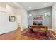 Modern office space with stylish desk, wood floors, and ample natural light at 10360 E 57Th Pl, Denver, CO 80238