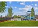 Community pool featuring a large slide with shaded seating and picnic areas at 10360 E 57Th Pl, Denver, CO 80238