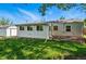 Grassy backyard with storage shed and a well-maintained home exterior, offering a relaxing outdoor space at 2751 S Elm St, Denver, CO 80222