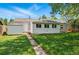 Landscaped backyard featuring a well-maintained lawn and access to a convenient storage shed at 2751 S Elm St, Denver, CO 80222