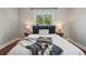 Well-lit bedroom featuring stylish decor, hardwood floors, a comfy bed, and natural light at 2751 S Elm St, Denver, CO 80222