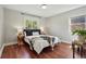 Comfortable bedroom with natural light, hardwood floors, and tastefully coordinated decor at 2751 S Elm St, Denver, CO 80222