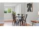Cozy dining area features a round table, modern chairs, and plenty of natural light at 2751 S Elm St, Denver, CO 80222