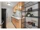Functional kitchen featuring wood cabinets, white countertops, and modern appliances at 2751 S Elm St, Denver, CO 80222