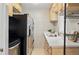 Efficient kitchen area includes stainless steel appliances, ample counter space, and convenient storage at 2751 S Elm St, Denver, CO 80222