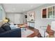 Cozy living room with wood floors, bright windows, neutral paint and comfortable seating at 2751 S Elm St, Denver, CO 80222