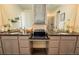 Bright bathroom featuring dual vanities with granite countertops and a glass shower at 1056 S Elk Way, Aurora, CO 80018