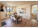 Elegant dining room featuring stylish furniture, modern decor, and natural light at 1056 S Elk Way, Aurora, CO 80018