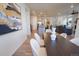 View of kitchen and living room from dining room; open layout, hard wood flooring at 1056 S Elk Way, Aurora, CO 80018