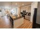 Modern kitchen with a large island, stainless steel appliances, and granite countertops at 1056 S Elk Way, Aurora, CO 80018