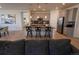 Modern kitchen with a large island, stainless steel appliances, and granite countertops at 1056 S Elk Way, Aurora, CO 80018