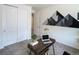 Bright home office featuring a modern desk, stylish decor, and natural light from windows at 1056 S Elk Way, Aurora, CO 80018