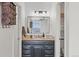 Stylish bathroom with a vanity, mirror, and an elegant three-light fixture at 2569 Devonshire Ct # 72, Denver, CO 80229