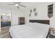 Bright bedroom showcasing an ensuite bathroom, bed, and dresser at 2569 Devonshire Ct # 72, Denver, CO 80229