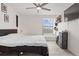 Bedroom with a bed, ceiling fan, and a window with blinds at 2569 Devonshire Ct # 72, Denver, CO 80229